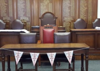 A former clerk to two community councils paid more than £100,000 to herself